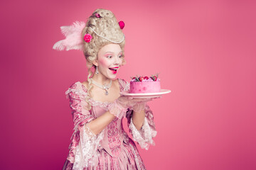 Fototapeta premium Photo of charming impressed marie antoinette wear rich dress eating birthday cake empty space isolated pink color background