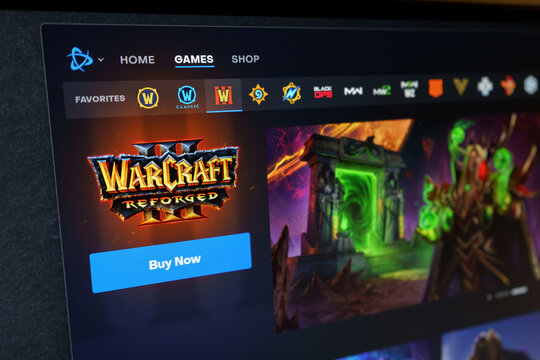 DNIPRO, UKRAINE - JUNE 29, 2026: Warcraft III Reforged strategy game page in Blizzard Battle.net launcher, close up on a PC monitor screen with "Buy Now" button and Dark Portal artwork.