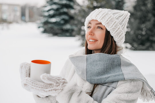 Ukrainian Woman Enjoying Quiet Winter Morning with Warm Mug Outdoors
