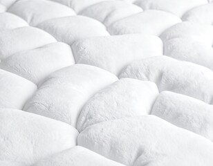 Fototapeta premium Close-up textured white fluffy surface with repeating quilted pattern