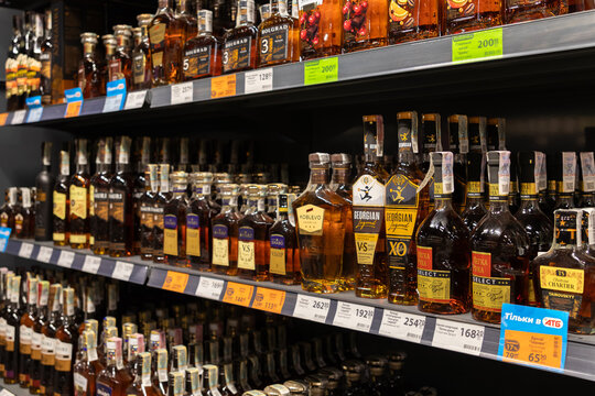 Horodok, Ukraine - March 23, 2026: Georgian Legend brandy bottles displayed on shelves at an ATB supermarket, showcasing various alcohol products in a retail shopping environment