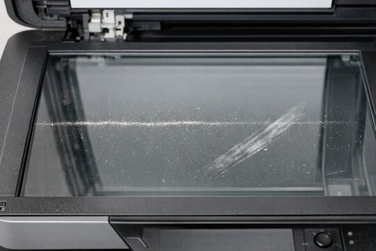 A classic black and white photograph of an old printer, perfect for nostalgic or vintage-themed projects