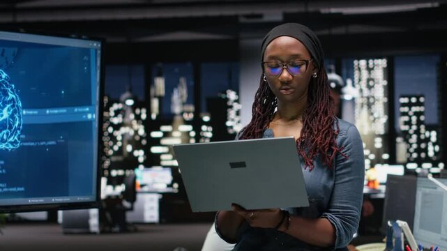 Programmer in office developing complex machine learning algorithms simulating human brain thought processes. IT professional deploys AI tools, performing software quality assurance.