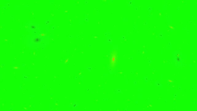 Particles drift slowly across a vivid green screen background to provide a versatile element for video compositing and special effects work.