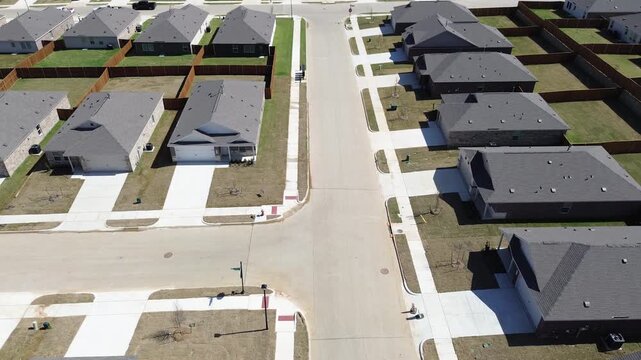 Subdivision Intersection Grid show where Fender Road intersects local street layout near newly constructed single-family residences. Clean concrete sidewalks frame dormant winter turf, Aubrey, TX