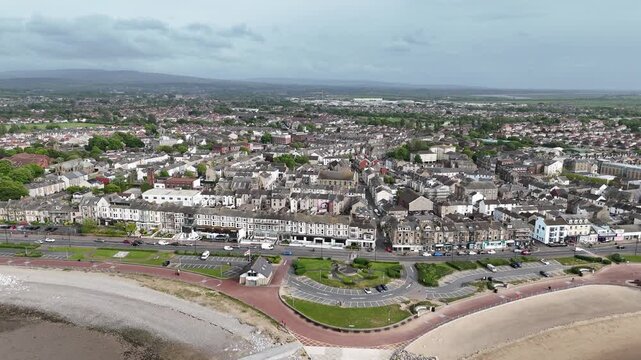 Seafront houses Morecambe UK ascending drone aerial view