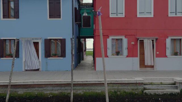 Quiet Colorful Venetian Canal Street With Wooden Dock