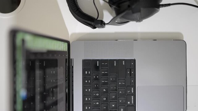 Laptop overhead headphones, smartphone for modern work environment concepts