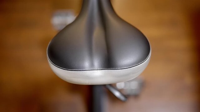 Comfortable stationary bike seat for home gym or fitness studio scene