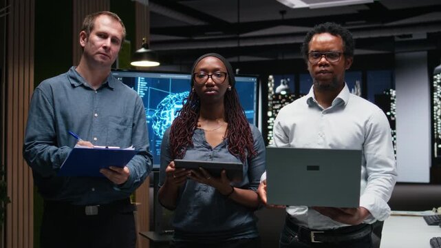 Portrait of engineering team automating mobile app development tasks using AI scripts. Teamworking colleagues leverage AI to accelerate feature implementation.