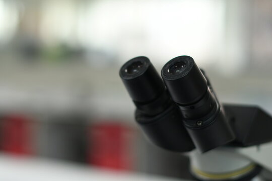 black microscope in the lab, blured background