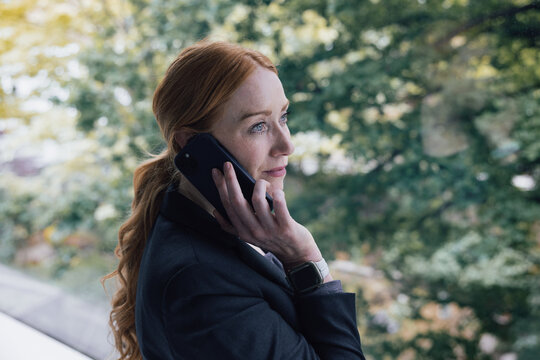 Woman on Phone in Stylish Office Environment