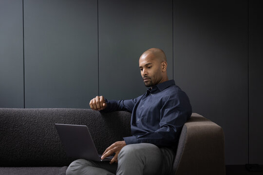 Businessman Working on Laptop in a modern office