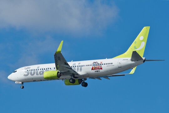 Solaseed Air Boeing 737-800 (JA809X) with Okinawa City promotional livery approaching Haneda Airport