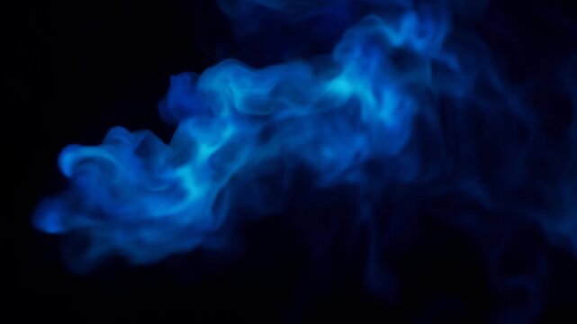 Vibrant blue neon smoke and wispy gas clouds swirling dynamically against dark empty space background. Magic energy and abstract chemical reaction concept