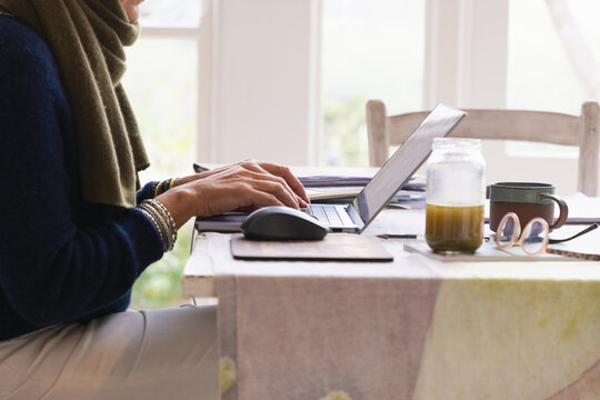 adult woman using laptop computer at home