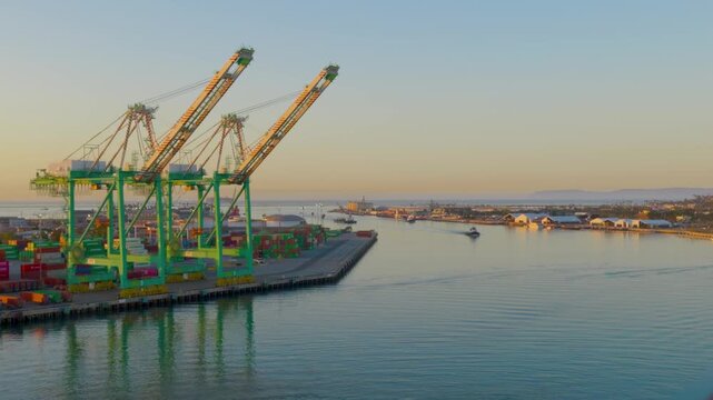 San Pedro, CA, USA &ndash; June 10, 2026:  Container port terminal with large gantry cranes at sunset
