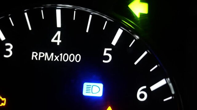 Car Tachometer RPM Gauge Close Up Dark Dashboard Night Drive