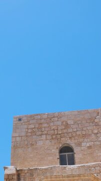 Vertical shot. The minaret of Umar ibn al-Khattab's next to the Church of the Holy Sepulchre in the Old City of Jerusalem. Traveling in Israel.