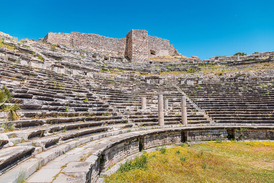 Ancient Roman theater of Miletus in Turkey, standing under a clear blue sky, presenting historic stone steps and walls