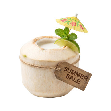 Fresh coconut drink with lime, mint, and summer accessories for tropical refreshment