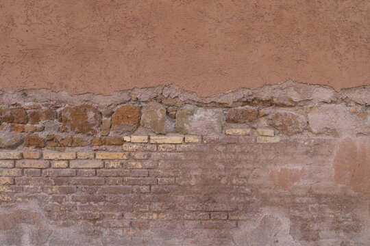 BACKGROUND TEXTURE OF AN OLD URBAN WALL,,RUINED,PEELING,CRACKED,DIRTY OR WITH FALLING PLASTER