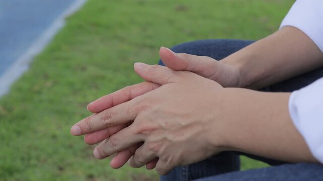 Man Fidgeting Hands Outdoors Expressing Stress Anxiety or Relaxation