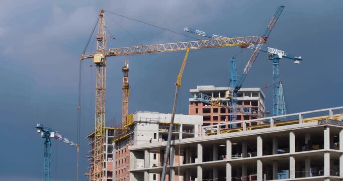 Zoom out 4K footage of a construction site, where towering cranes and hard-working crews collaborate to build high-rises. Each moment captures the ambition involved in creating city skylines.