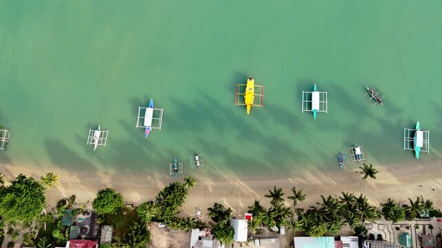 Horizontal flyover aerial shot of Port Barton coast in San Vicente, Philippines
