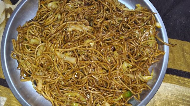 Close-up of Spicy Veg Hakka Noodles chow mein Stir-Fry on Plate