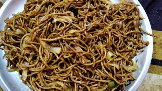 Close-up of Spicy Veg Hakka Noodles chow mein Stir-Fry on Plate
