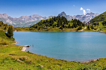 Mountain lake with alpine pastures in the Swiss Alps near Mount Pilatus  © hecke71