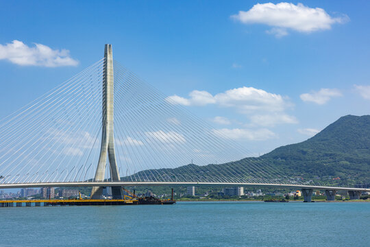 Danjiang Bridge in Tamsui Taiwan with blue sky