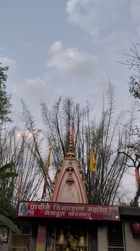 Ancient Chinnaharan Mahadev Hindu Temple Spire Against Bamboo Forest
