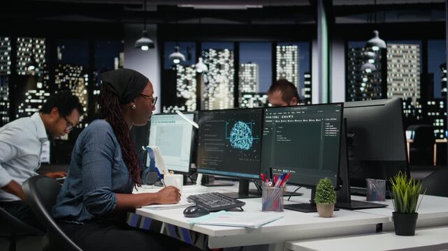 Technician writing down automation ideas on paper to streamline repetitive tasks using AI scripts for coding and software work.