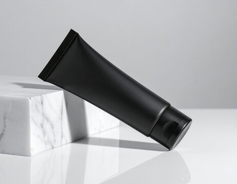 Black cosmetic tube mockup template on marble block with clean studio light