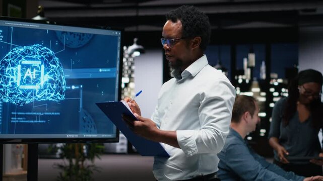 Manager in office writing on notepad, taking notes of AI system bugs to fix with debugging and troubleshooting context for AI development workflow.