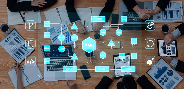 Business Meeting with Digital Interface Displaying Data Analysis and Project Management Concepts on a Wooden Table Quark.