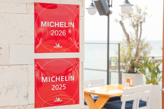 11 May 2026, Yalikavak, Turkiye: Michelin Guide plaques signifying restaurant recognition for 2025 and 2026, set in an elegant outdoor dining area