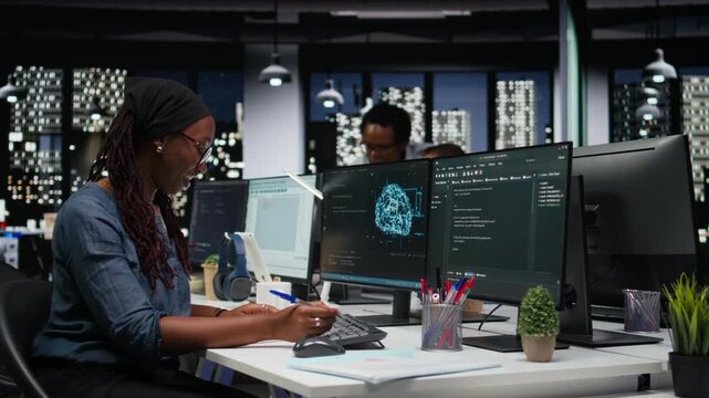 Software developer in office writing on notepad, working to fix bugs in artificial intelligence system. IT expert taking notes at desk, troubleshooting neural network errors in tech startup.