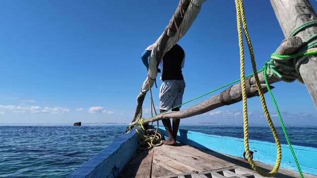 Man sailing on a dhow, Nampula Province, Island of Mozambique, Mozambique