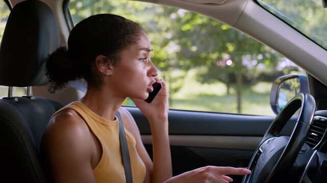 Angry mad African American business woman shouting mobile phone inside car irritated female driver businesswoman arguing quarrel sad frustrated girl conflict calling auto automobile transport vehicle