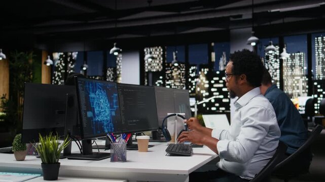 Tech startup IT specialist developing AI algorithms in high rise office, listening music. Admin wearing headphones debugging neural network brain models.