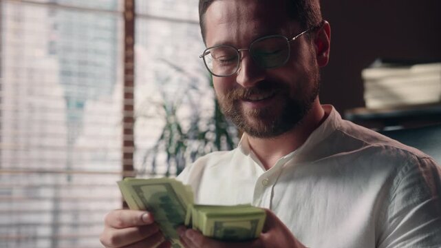 Happy Caucasian business man counting stack dollar banknotes indoor office businessman smiling accountant manager receiving cash calculating budget finance success male hold money profit income wealth