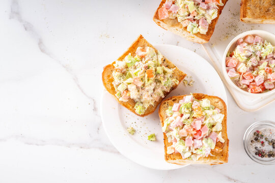 Trendy Viral Chopped Italian Sandwiches. Chopped Caesar Salad Sandwiches,  on grill fried ciabatta rolls, tuna, ham and chicken meat, fresh vegetables, cheese and creamy salad dressing