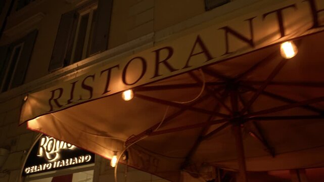 Restaurant Awning and Warm Evening Dining Atmosphere at Night in Rome Italy Shot with Cinema Camera