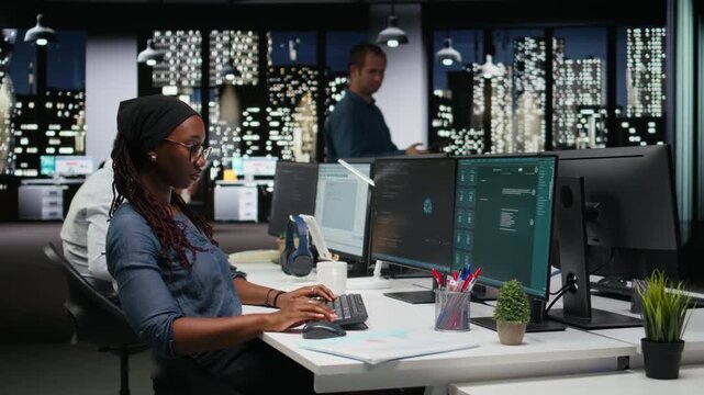 Data scientist solving tasks with AI LLM chatbot answering prompts using predictive technology. Female engineer using computer to interact with large language model program for coding workflows.