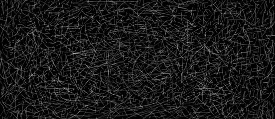 Fototapeta premium Grey scribbles on black background texture