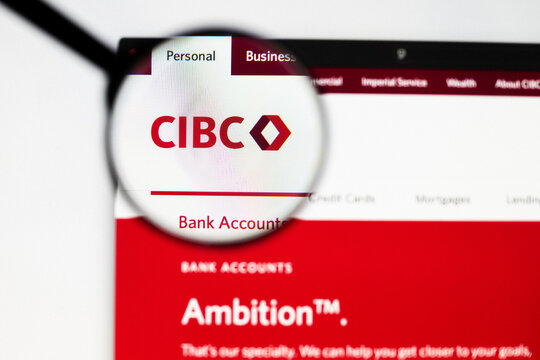 Milan, Italy 2026, 20 Apr Closeup of CIBC Canadian Imperial Bank website on a laptop screen. CIBC Canadian Imperial Bank logo under a magnifying glass.