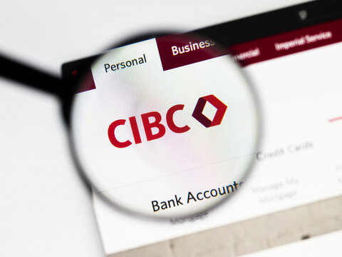 Milan, Italy 2026, 20 Apr Closeup of CIBC Canadian Imperial Bank website on a laptop screen. CIBC Canadian Imperial Bank logo under a magnifying glass.